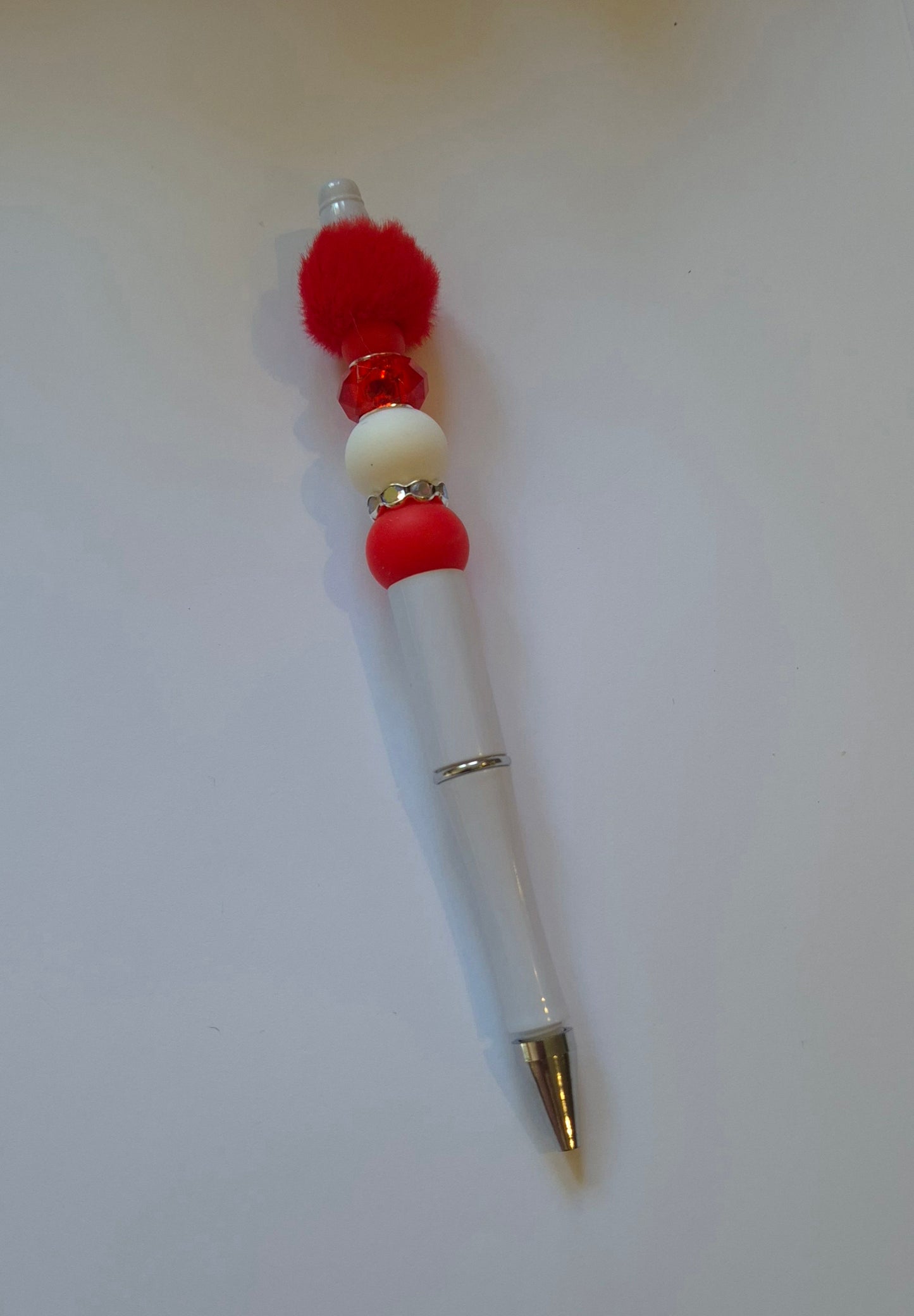 White pen Fluffy red Bead