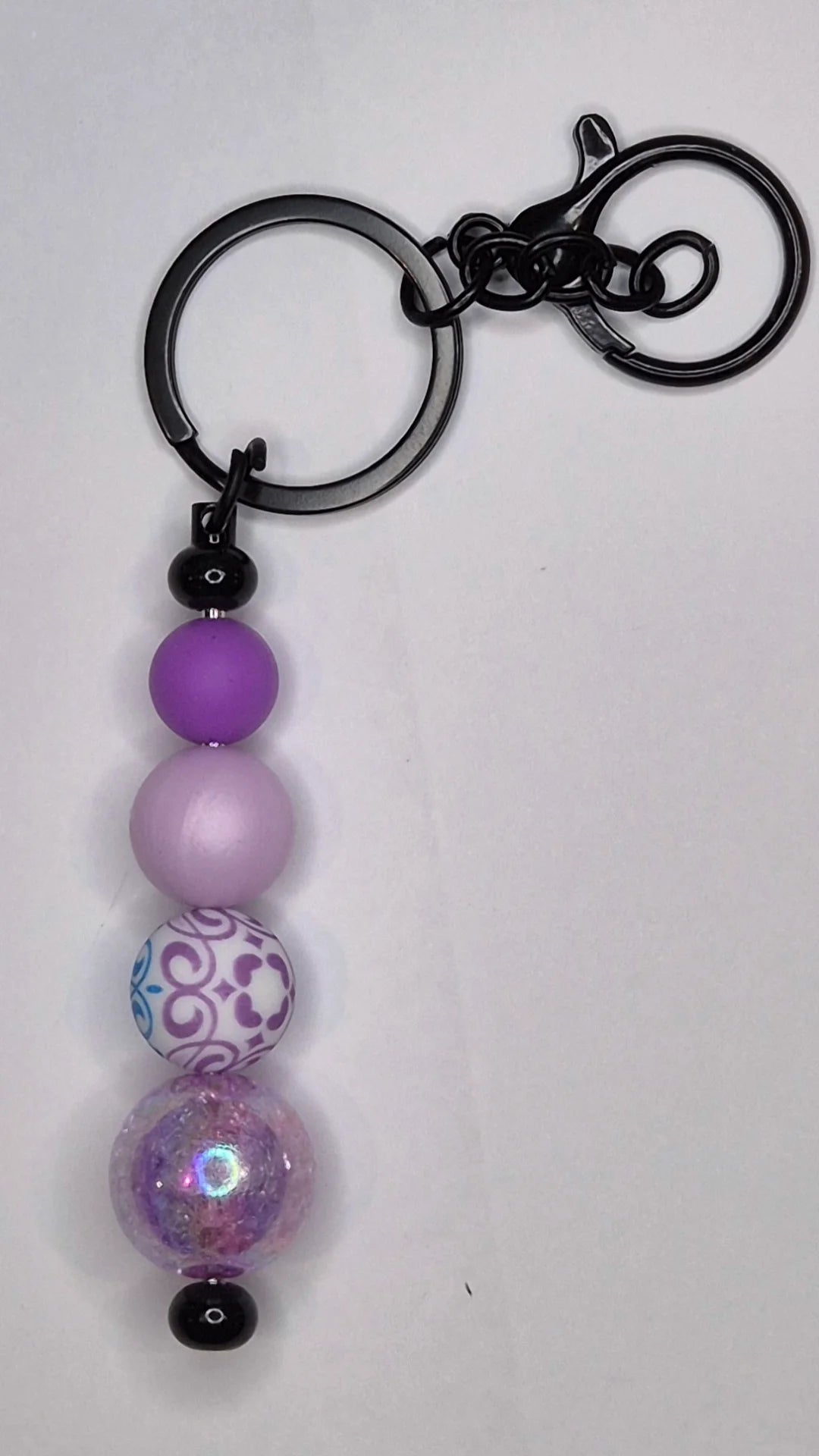 Black keyring with purple coloured beads