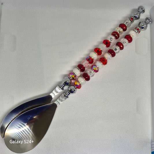 Red and white beads decorated salad spoons